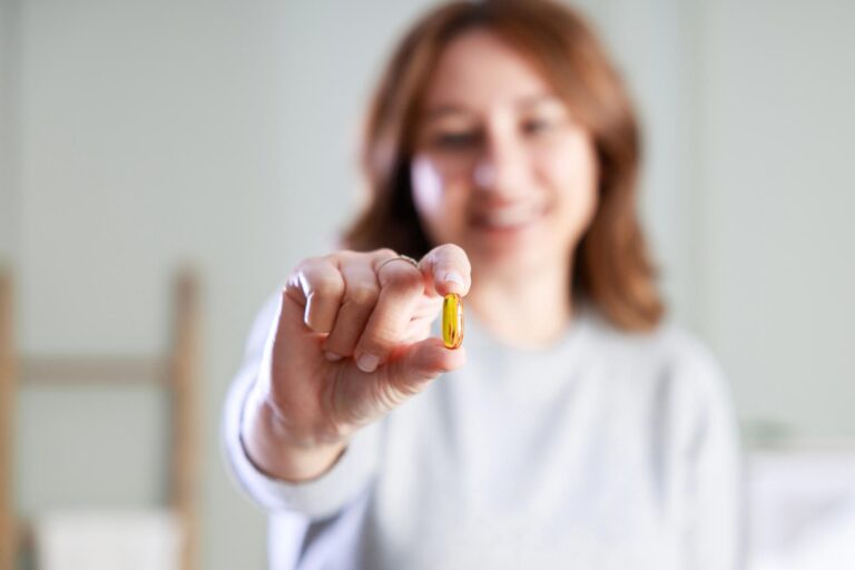Image showing a Lady showing a pill